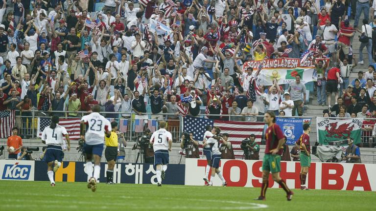 SUWON, SOUTH KOREA - JUNE 05: Brian McBride celebrates with Damarcus Beasley after scoring the second goal for the USA during the World Cup 1st round match between Portugal (2) and USA (3) at the Suwon World Cup Stadium on June 5th, 2002 in Suwon, South Korea. (Photo by Simon Bruty/Anychance/Getty Images)