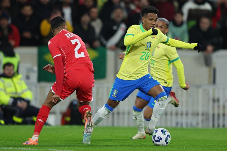 LILLE, FRANCE - NOVEMBER 18: (L-R) Ali Abdi of Tunisia, Estevao of Brazil  during the  International Friendly match between Brazil  v Tunisia at the Stade Pierre Mauroy on November 18, 2025 in Lille France (Photo by Rico Brouwer/Soccrates/Getty Images)