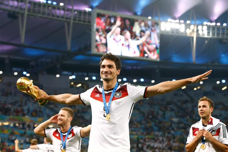 Football - Germany v Argentina - FIFA World Cup Brazil 2014 - Final - Estadio do Maracana, Rio de Janeiro, Brazil - 13/7/14..Actionshot, Germany's Mats Hummels celebrates winning The World Cup with the trophy..Mandatory Credit: Action Images / Andrew Boyers..
